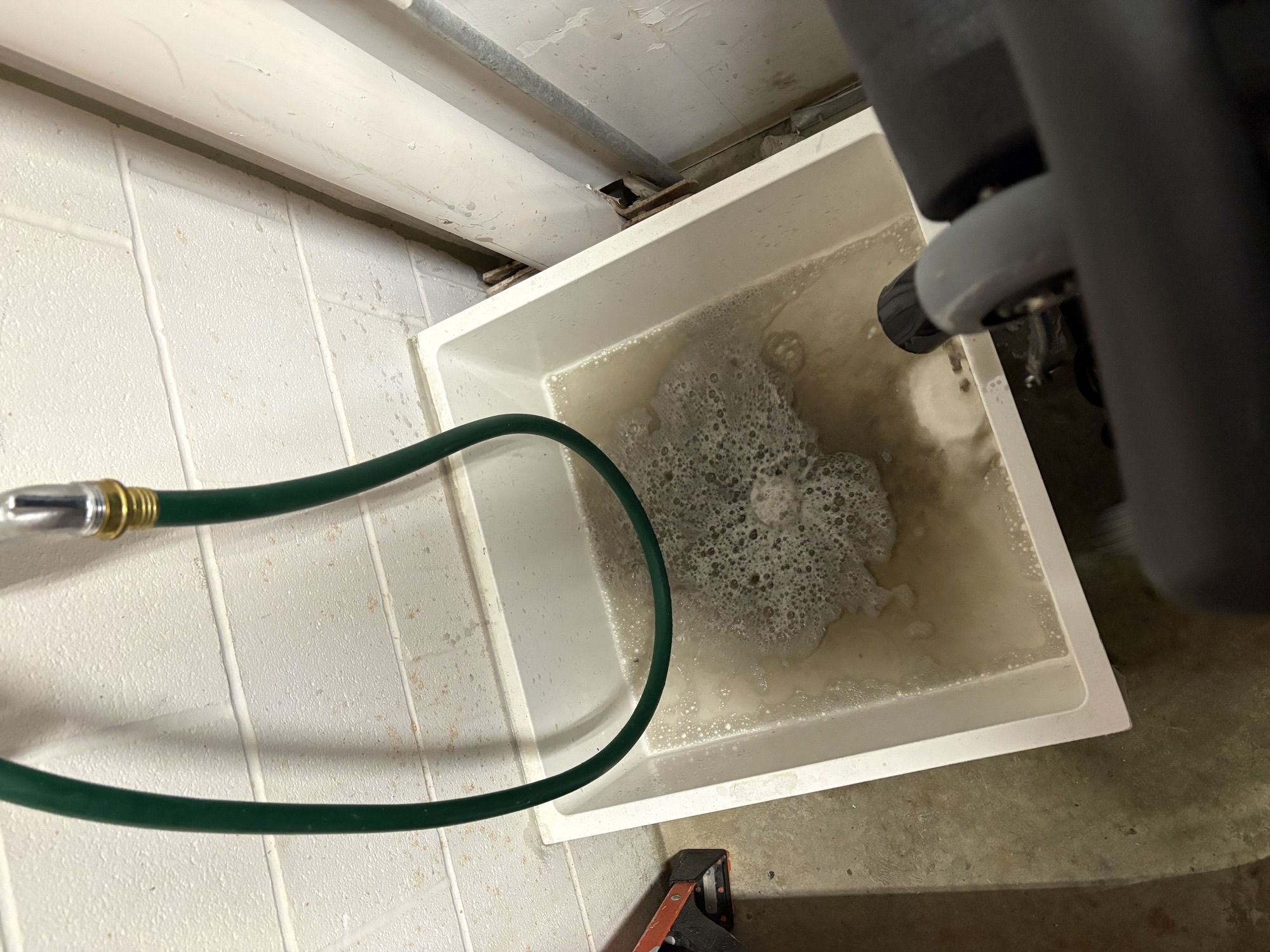 Recovered soil and rinse water after carpet extraction